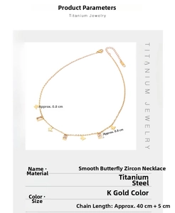 Detail of titanium steel butterfly necklace with gold plating and rectangular zircon stone