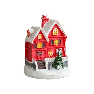 Miniature red snowy Christmas cabin with tiny green pine tree desktop ornament