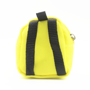 Detail view of mini yellow backpack coin purse with dual straps and sturdy metal zipper