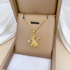 Gold titanium steel cat necklace with micro-pave diamonds and a round pearl charm