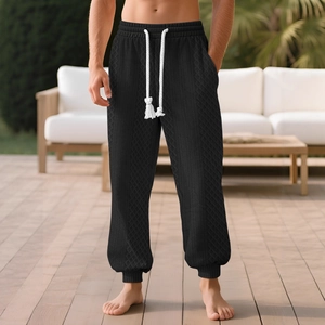 Men's black waffle knit joggers with white drawstring for casual outdoor style