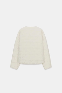 Detailed back view of a cream-white quilted jacket featuring elegant wave patterns