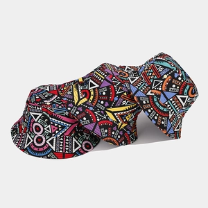 Close-up of three Bohemian printed bucket hats with intricate tribal patterns and vivid colors
