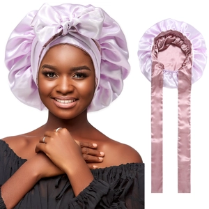 Pale purple satin bonnet with large bow and pink ribbons for hair protection