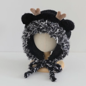 Detailed view of plush faux mink fur winter hat with antlers and soft fluffy lining