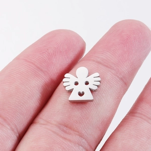 Close-up of a small stainless steel angel pendant with heart cutout for DIY jewelry making
