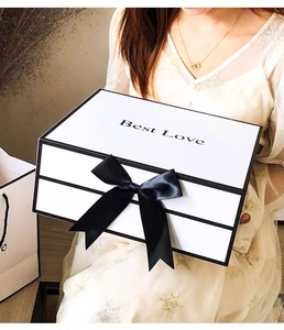 Chic white rectangular gift box with black ribbon bow and Best Love engraving detail
