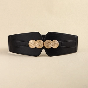 Detail of a black elastic waist belt featuring a textured gold metal interlocking buckle