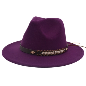 Detail of deep purple wool fedora hat featuring a brown leather band with metal rivets