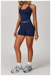 Detail of navy blue halter yoga set showing moisture-wicking fabric and high-waist fit
