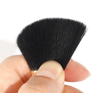 Pro fan brush with dense black bristles and gold ferrule for highlighting and powder