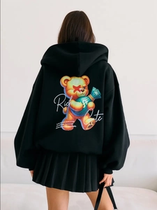 Oversized black hoodie for women featuring a cool cartoon bear graphic on the back