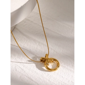 Detailed macro shot of 18k gold-plated stainless steel geometric pendant with sleek chain