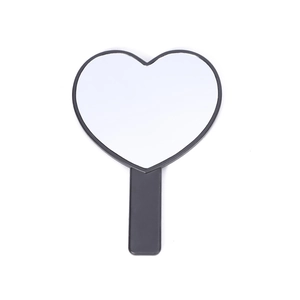 Cute heart-shaped handheld makeup mirror with black frame and ergonomic handle