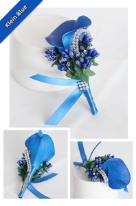 Detail view of Klein blue calla lily boutonniere with crystal accents and rear pin attachment