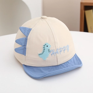 Detail of baby dinosaur cap with soft brim, 3D fabric spine and happy embroidery