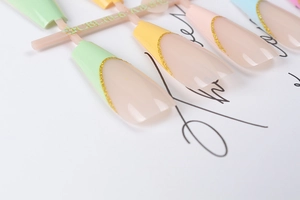 Macro view of long ballet press-on nails with colorful pastel tips and glitter accents
