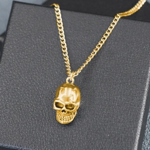 Hip hop skull pendant necklace in gold finish with Cuban metal chain on gift box
