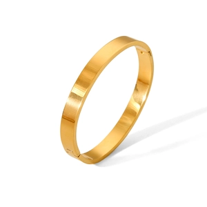 Detailed view of wide flat gold-plated stainless steel bangle with side hinge opening