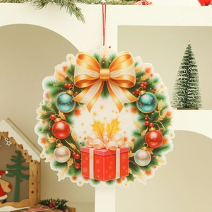 Christmas wreath door hanger with gold bow and ornaments against a home decor backdrop