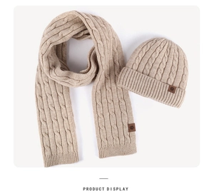 Detailed cable knit texture of beige winter beanie hat and matching scarf set