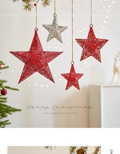 Detail of red and silver Christmas star ornaments with glitter finish on festive tree