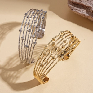 Multilayer beaded open cuff bracelet with metallic beads in gold and silver finish