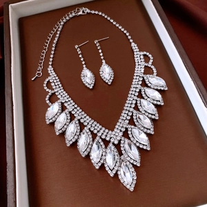 Macro detail of French water-drop tassel necklace and marquise-cut crystal jewelry set