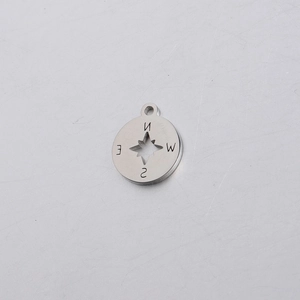 Detailed view of silver stainless steel compass pendant with hollow star and NESW letters