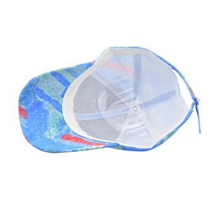 Internal view of colorful baseball cap showing white sweatband and blue adjustable strap