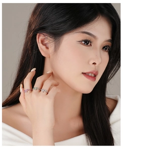 Three elegant S925 silver bow rings set with pink, green and white zircon on hands