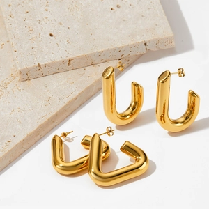 Polished gold PVD stainless steel geometric triangle and U-shaped earrings on stone decor