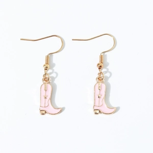 Close-up of pink cowboy boot earrings with gold trim and glossy enamel finish