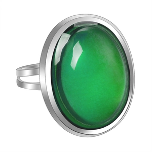 Macro view of vintage silver ring with oval color-changing gemstone and hollow band