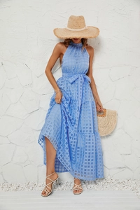 Detailed macro view of the blue checkered fabric texture on this halter neck maxi dress