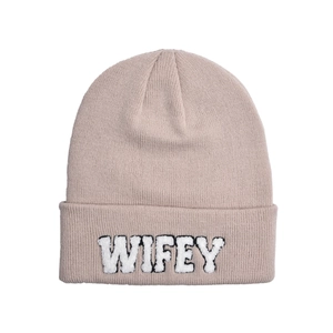 Detailed view of dusty pink beanie with white fuzzy WIFEY patch embroidery