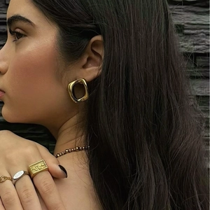 Minimalist gold geometric earrings and sunburst signet ring with 11:11 engraving