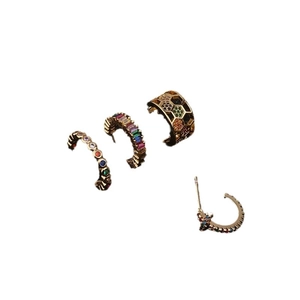 Set of four gold bohemian star earrings and ear cuffs with colorful zircon stones