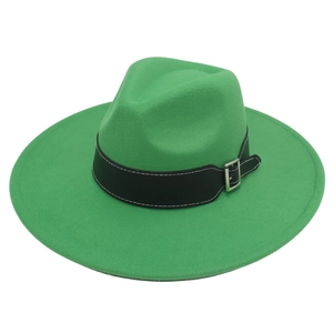 Detail of green wool fedora hat featuring a black leather band with a silver metal buckle