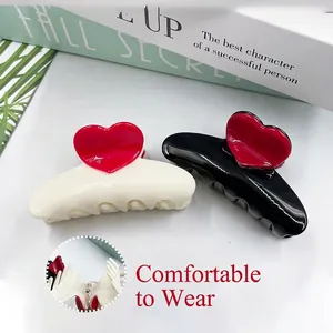 Chic 8.3cm heart hair claw clip set in black and cream resin with red heart accent