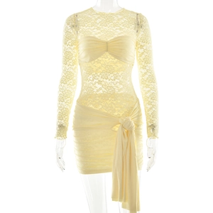 Close-up of yellow lace long sleeve dress featuring hollow-out details and waist tie