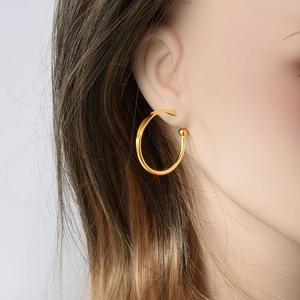 Minimalist 304 stainless steel gold hoop earring with a bead detail on model