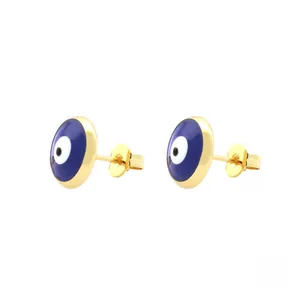 Macro view of evil eye stud earrings with blue enamel finish and 18K gold plated metal