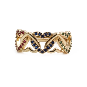 Macro shot of gold-plated heart ring with red, blue, and green zircon inlay detailing