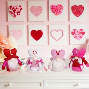 Set of four Valentine's Day gnomes spelling LOVE on a clean white countertop decor