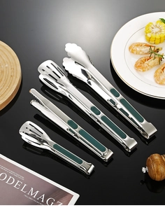 Macro view of SUS 304 stainless steel food tongs with green non-slip silicone handles