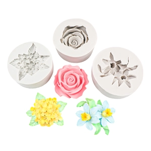 Grey silicone flower molds set for fondant with rose and hydrangea examples on white background