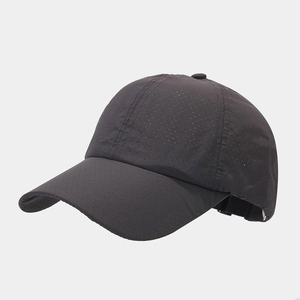 Detail of dark grey breathable laser-cut holes on quick-dry fabric baseball cap