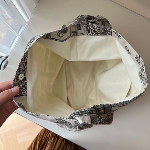Interior view of floral canvas tote bag showing roomy space and magnetic snap closure