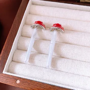 Creative mushroom pearl pendant earrings with silver needle on retro wooden jewelry box